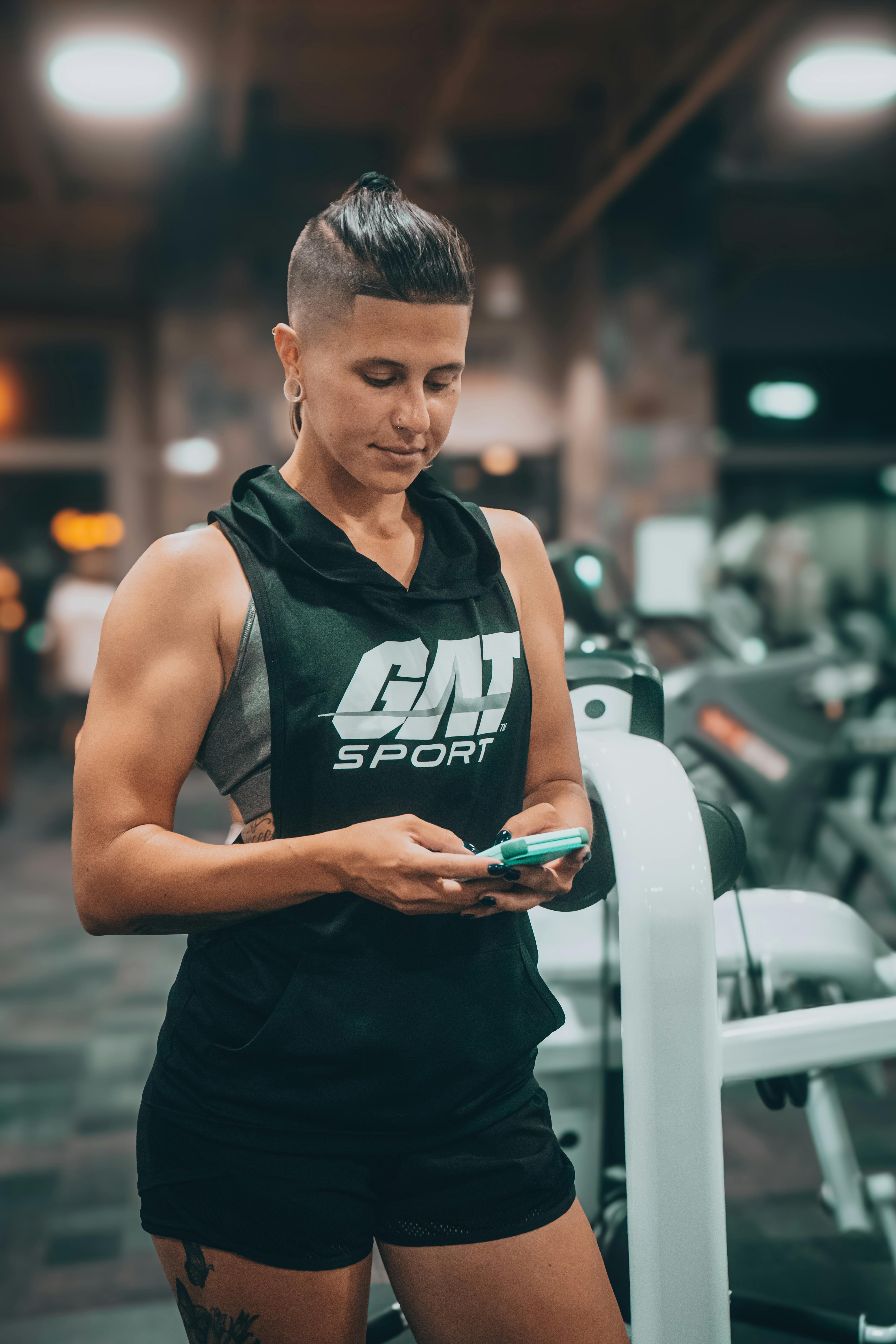 Athlete logging a session between sets